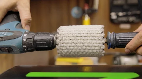 Close Up Of The Drill Machine Brushing And Polishing A Waxed Snowboard Stock Footage 125856710