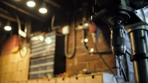 Close-up of a drill machine in a workshop. Carpentry wood processing factory. Stock Footage 122571706