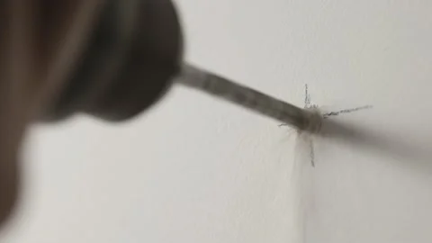 Close-up of drilling a hole in a wall. Drill with jackhammer function. 스톡 동영상 229654075