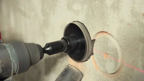 Close-up drilling holes in the wall under the socket Stock Footage 147655701