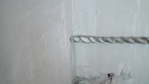 Close up Drilling for laying air conditioning pipes through the wall Stock Footage 235813412