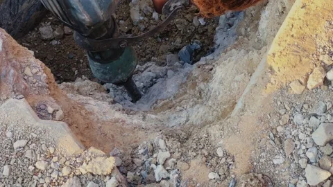 Close-Up of Drilling Machine Digging into Ground Stock Footage 334172275