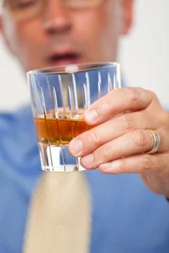 Close up of a drink being held by a man Stock Photos