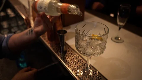 Close up of drink being poured at the bar with straws Stock Footage 106810383