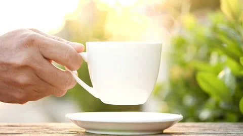 Close-up drink hot coffee with steaming of coffee or tea cup, slow motion Stock-Footage 143275143