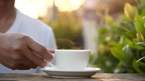 Close-up drink hot coffee with steaming of coffee or tea cup, slow motion Stock-Footage 143275829