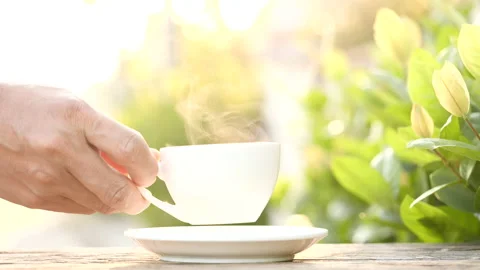 Close-up drink hot coffee with steaming of coffee or tea cup, slow motion Stock-Footage 143277151