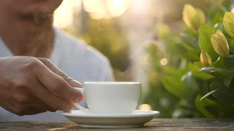 Close-up drink hot coffee with steaming of coffee or tea cup, slow motion Stock-Footage 143279182