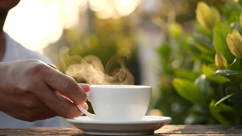 Close-up drink hot coffee with steaming of coffee or tea cup, slow motion Stock-Footage 143295292
