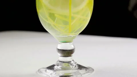 Close-up of a drink made from lemon, sugar, orange, mint, water. Slow motion. HD Video stock 107558641