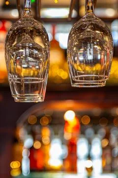 A close up of drinking glasses in a bar, with a shallow depth of field Stock Photos