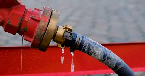 Close up of dripping fire water hydrant Stock Footage 126987770