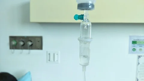 Close up dripping of iv saline solution in hospital Stock Footage 104119002