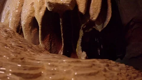 Close-up of dripping stalactites in a cave Stock Footage 313174248
