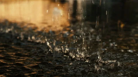 Close-up of the dripping water, in the sunlight Stock Footage