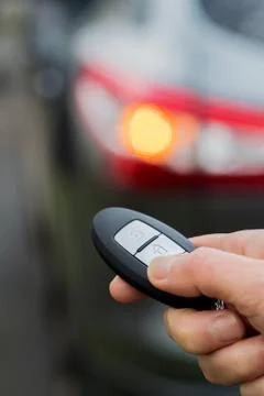 Close Up Of Driver Activating Car Security System With Key Fob 스톡 사진