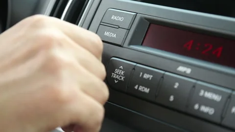 Close-up of Driver Adjusting Car Audio Volume in Seoul Stock Footage 333347223