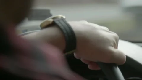 Close-up of Driver Hand on Steering Wheel with Watch Stock Footage 343936608