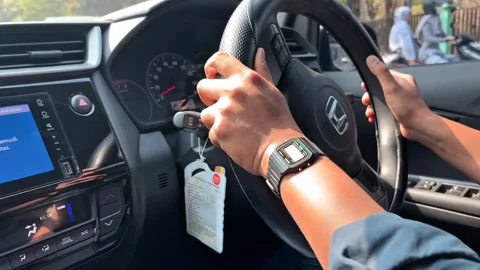 Close-up of Driver Hands Holding Steering Wheel While Driving Stock Footage 346438838