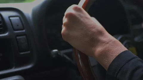 Close-up of a driver hands on the steering wheel inside a car... Stock Footage 336190256