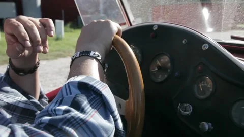 Close-Up of Driver Hands on Wooden Steering Wheel in Vintage Convertible Stock Footage 345274857