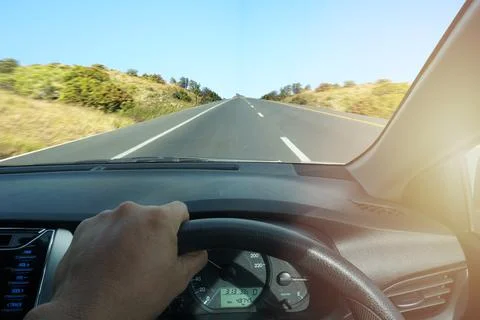 Close-up of the driver from the rear view on the highway, the maximum speed o Stock Photos