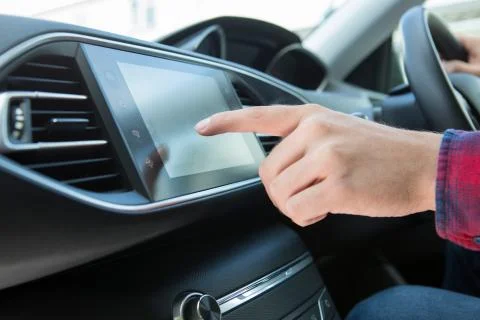 Close Up Of Driver Using Touchscreen In Car Stock Photos