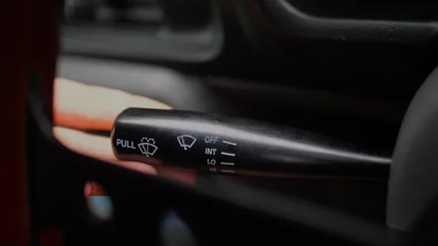 Close-up of driver’s hand adjusting the windshield wiper control... 스톡 동영상 339101354