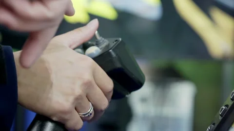 Close-up of a driver's hand with a joystick on a rig simulator. Stock Footage 163050038