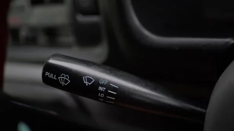 Close-up of driver’s hand operating the windshield... Stock Footage 339101341