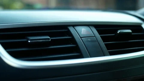 Close-up of Driver's hand is pressing emergency button on car dashboard. Stock Footage 120384499