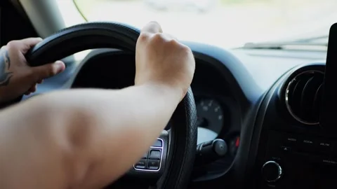 Close-up of driver’s hands holding the steering wheel... Stock Footage 316914140