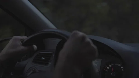 Close up Of  Driver's Hands On Steering Wheel at sunset drive. Stock Footage 96199973