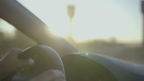 Close up Of  Driver's Hands On Steering Wheel at sunset drive. Stock Footage 96208242