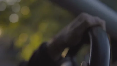 Close up Of  Driver's Hands On Steering Wheel at sunset drive. Stock Footage 96208907