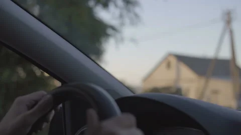 Close up Of  Driver's Hands On Steering Wheel at sunset drive. Stock Footage 96208995