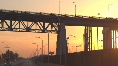 CLOSE UP: Driving through the industrial zone in Detroit city at golden sunset Stock Footage 85759158