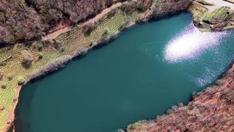Close Drone Approach to Lake With Cloud and Sun Reflections in 4K Stock Footage 339071510