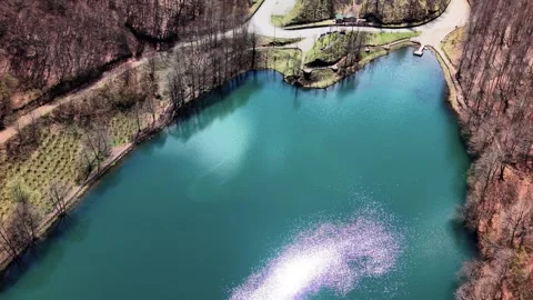 Close Drone Approach to Lake With Cloud and Sun Reflections in 4K 스톡 동영상 339074284