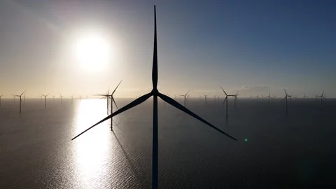 Close drone approach to rotating offshore turbine rotor Stock Footage 331828176