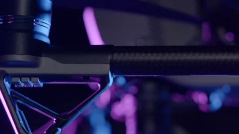 Close-up of drone camera gimbal in purple and blue lighting. DJI Inspire 2 Stock Footage 129287772