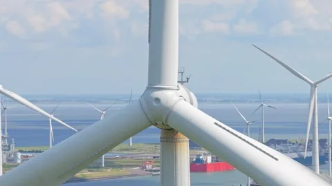 Close drone capture of wind turbine blades in rotation, renewable energy Stock Footage 315980728