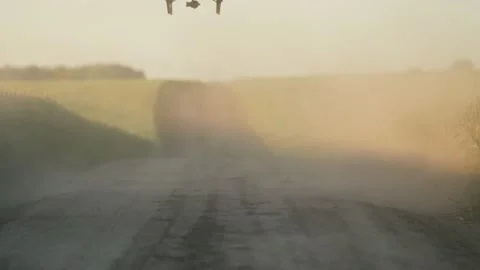 Close up drone flight over the rural road in between wheat fields left and right Stock Footage 219950259