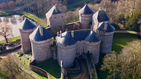 Close-up drone fly of medieval Castle of Lassay fortified castle surrounded by Vidéo 327494009