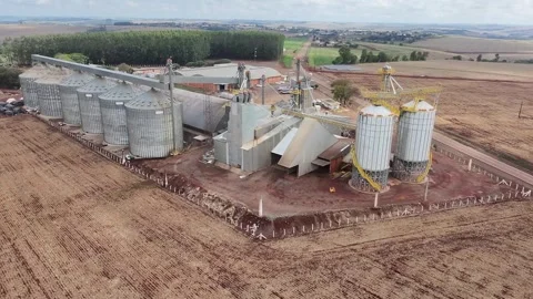 Close Drone Footage of Large Grain Silos and Company Grounds Stock Footage 320199318