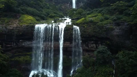 Close-Up Drone Footage of Waterfall Cascading from Mountains Stock Footage 285075302