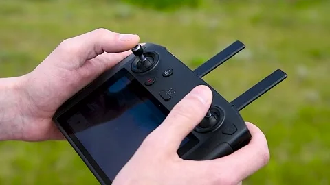 Close-up of a drone operator with a remote control in his hands Stock Footage 310045193