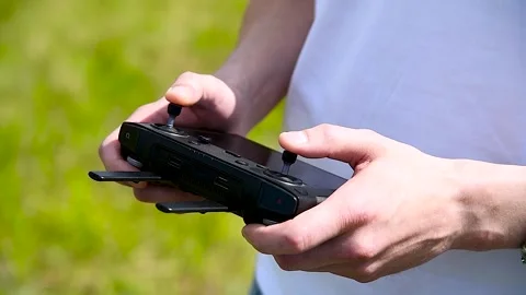 Close-up of a drone operator with a remote control in his hands Stock Footage 321241512