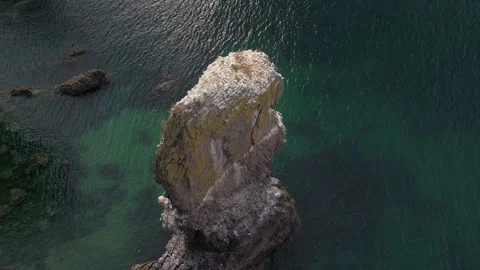 Close Drone Orbit Around Isolated Limestone Sea Stack at Elegug Stacks Stock Footage 346298302