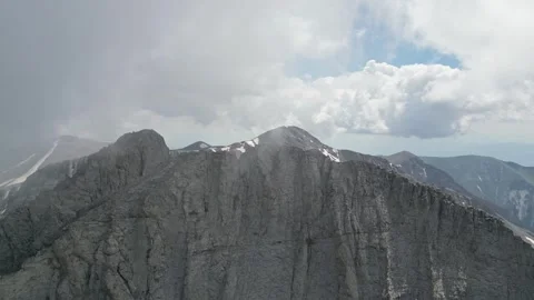 Close Drone Orbit Around Stefani Peak Cliffs with Clouds and Mount Mytikas i Stock Footage 340322300